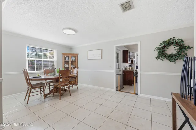a view of a livingroom with furniture and a window