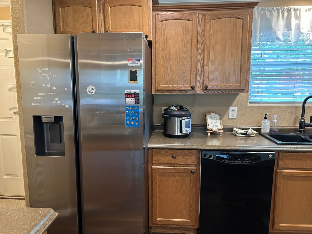 162 Cove View Drive Trinity, TX 75862 - Photo 11 of 50 a kitchen with stainless steel appliances granite countertop a refrigerator and a sink
