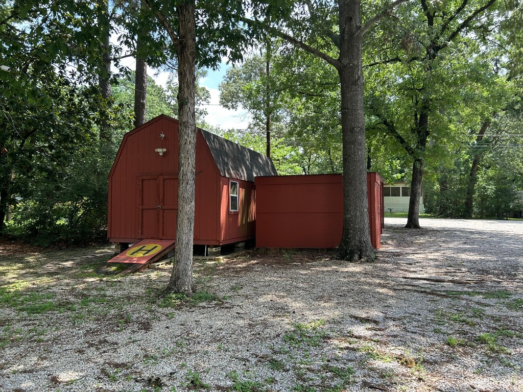162 Cove View Drive Trinity, TX 75862 - Photo 35 of 50 a view of a small barn in the middle of a yard