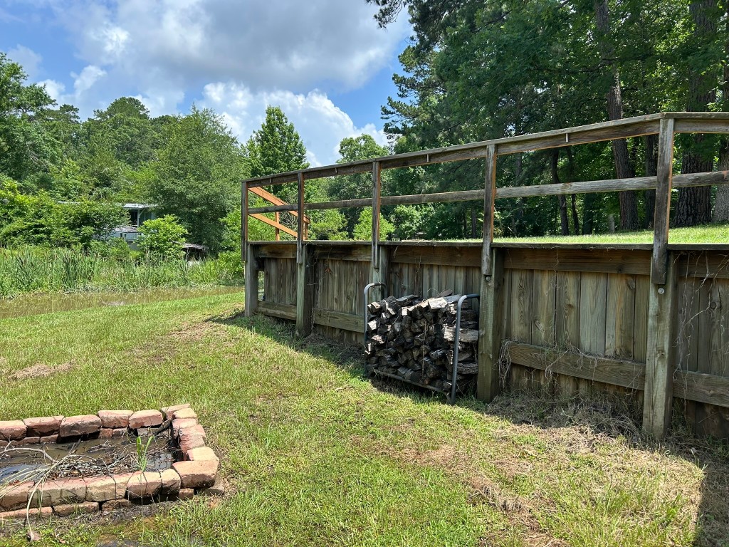 162 Cove View Drive Trinity, TX 75862 - Photo 39 of 50 a backyard of a house with wooden floor and outdoor seating