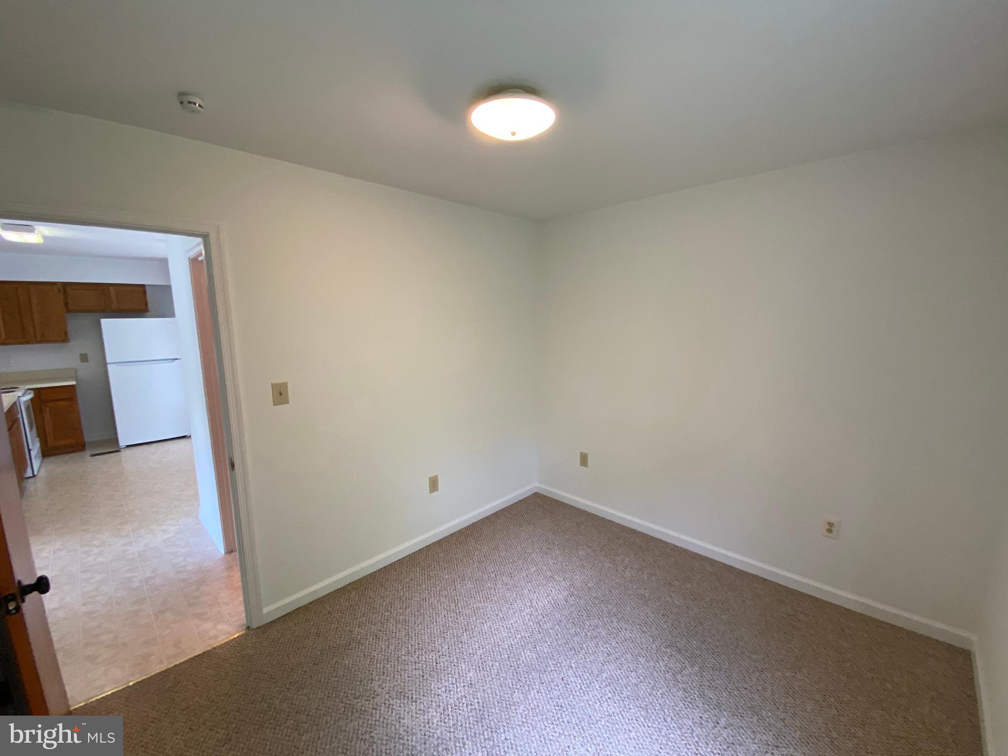 9298 Hayden Drive, Unit 14 King George, VA 22485 - Photo 12 of 17 a view of a room with wooden floor