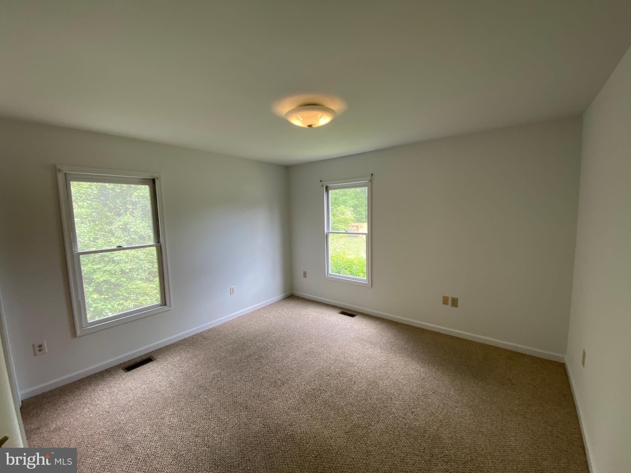 9298 Hayden Drive, Unit 14 King George, VA 22485 - Photo 13 of 17 an empty room with a window