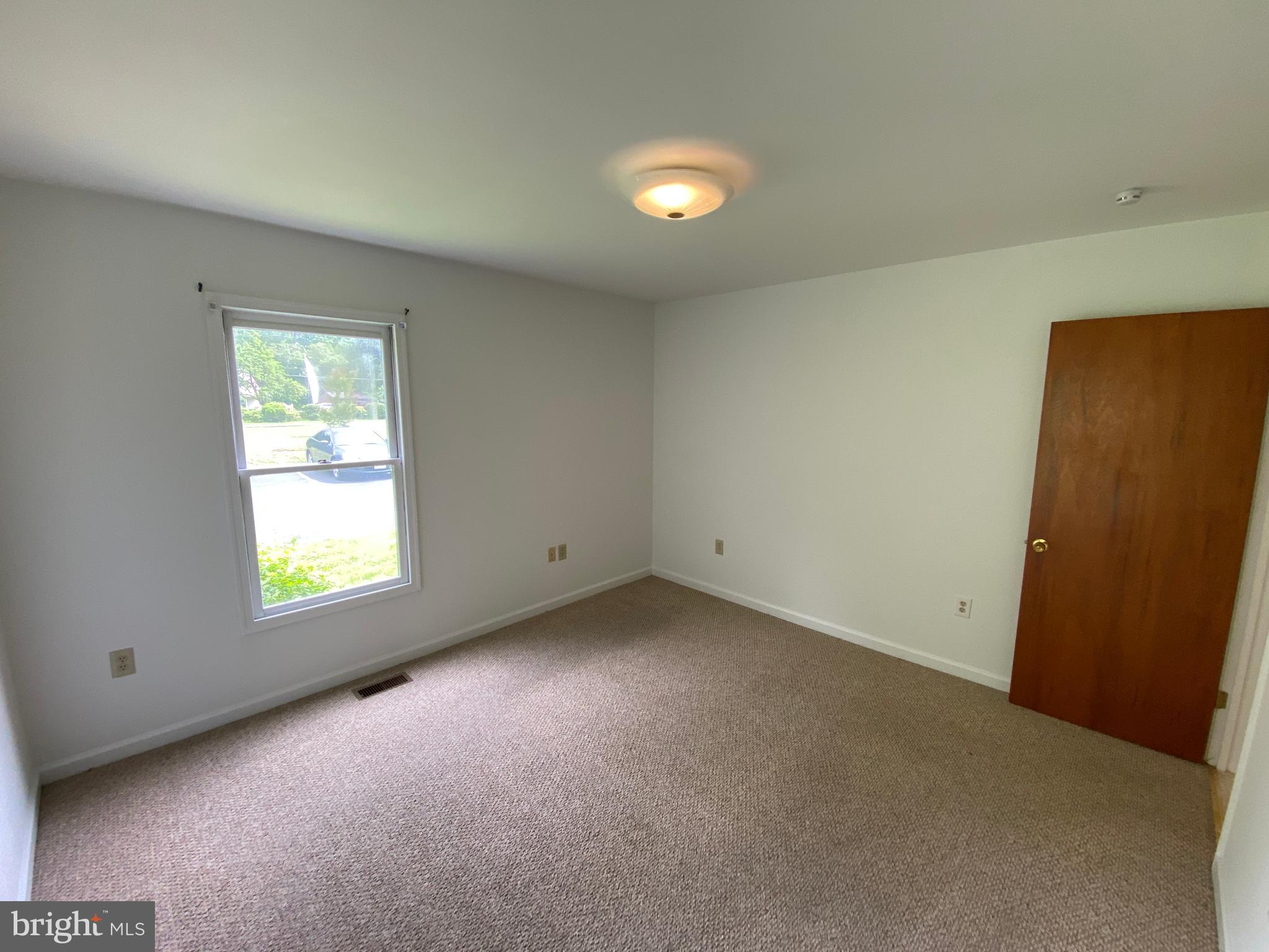 9298 Hayden Drive, Unit 14 King George, VA 22485 - Photo 16 of 17 an empty room with a window