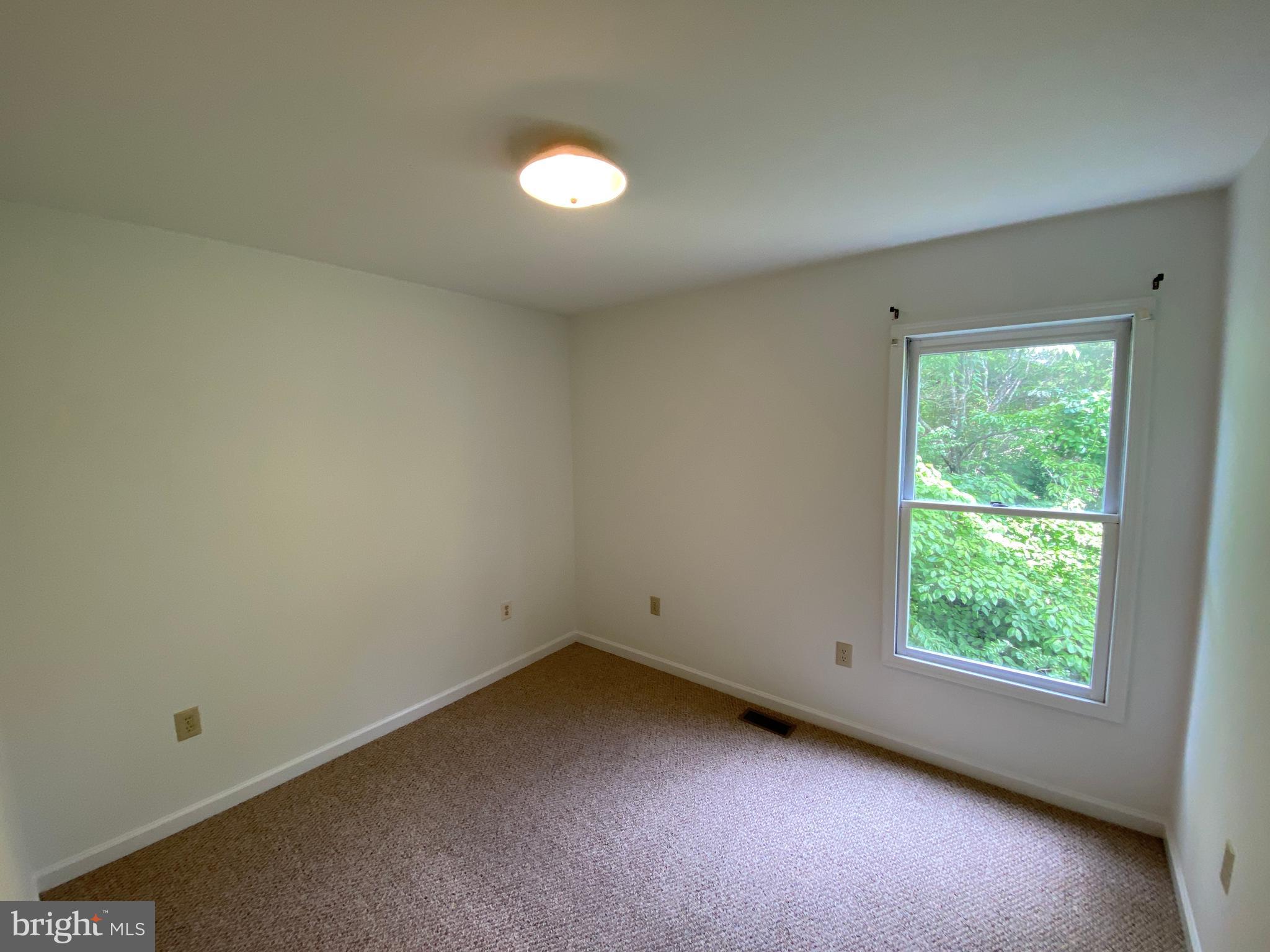 9298 Hayden Drive, Unit 14 King George, VA 22485 - Photo 9 of 17 an empty room with a window