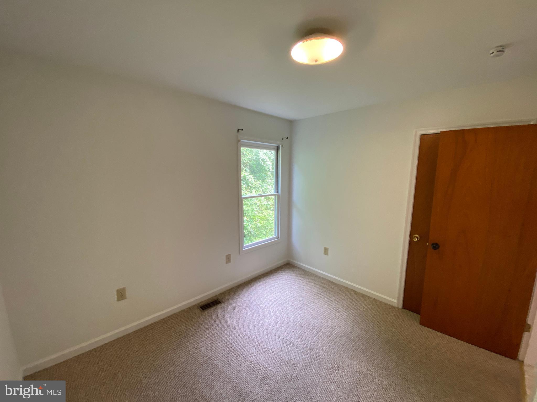9298 Hayden Drive, Unit 14 King George, VA 22485 - Photo 10 of 17 an empty room with a window