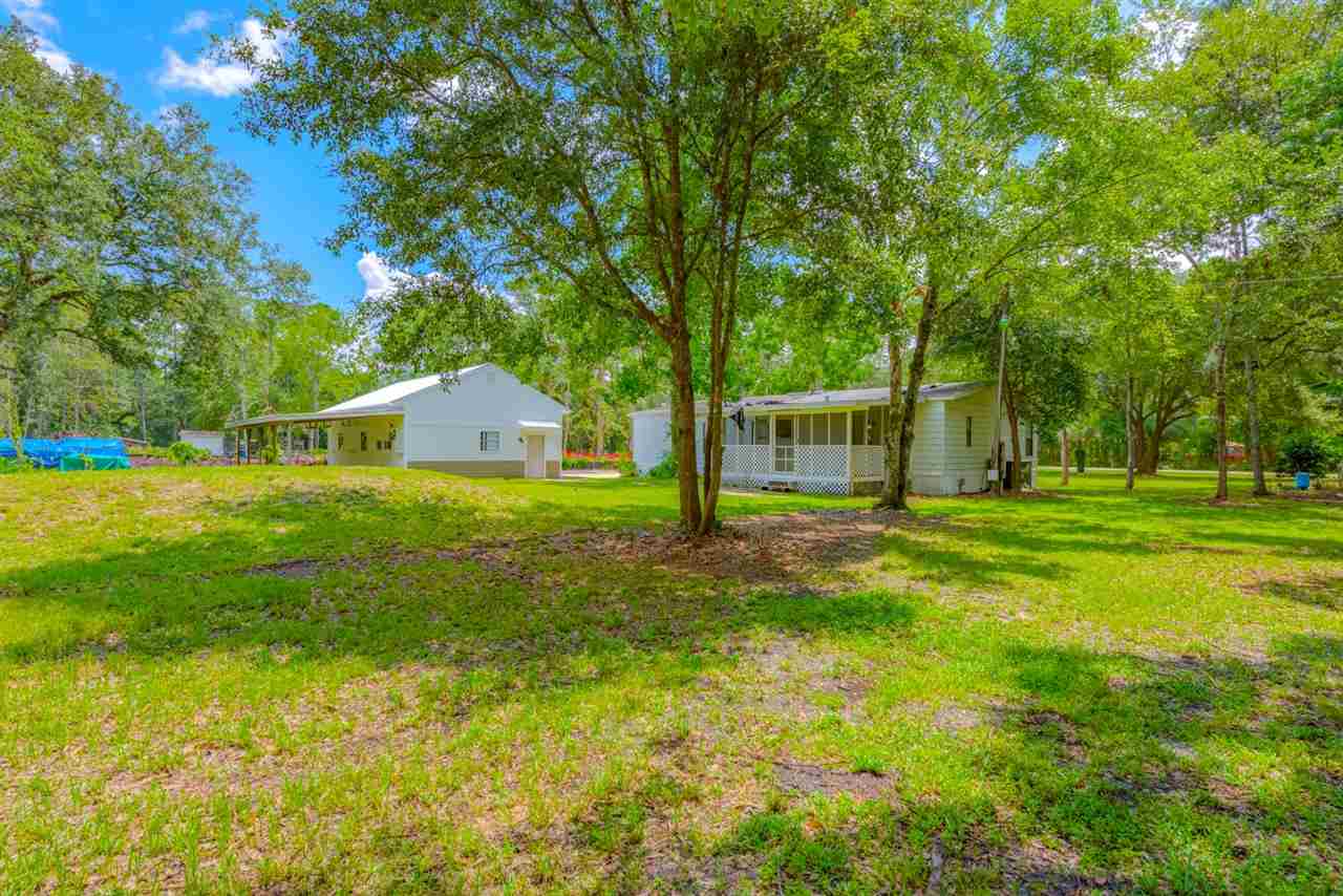 2360 Marlee Road South St. Johns, FL 32259 - Photo 10 of 22 a view of a house with backyard and tree