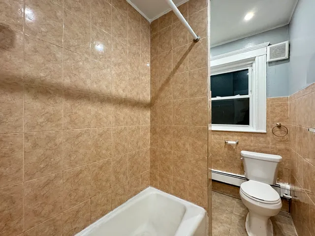 a bathroom with a toilet and a sink