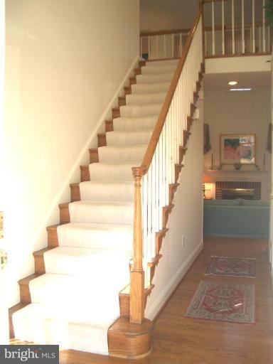 Two story Foyer entrance w/hard-wood flooring.