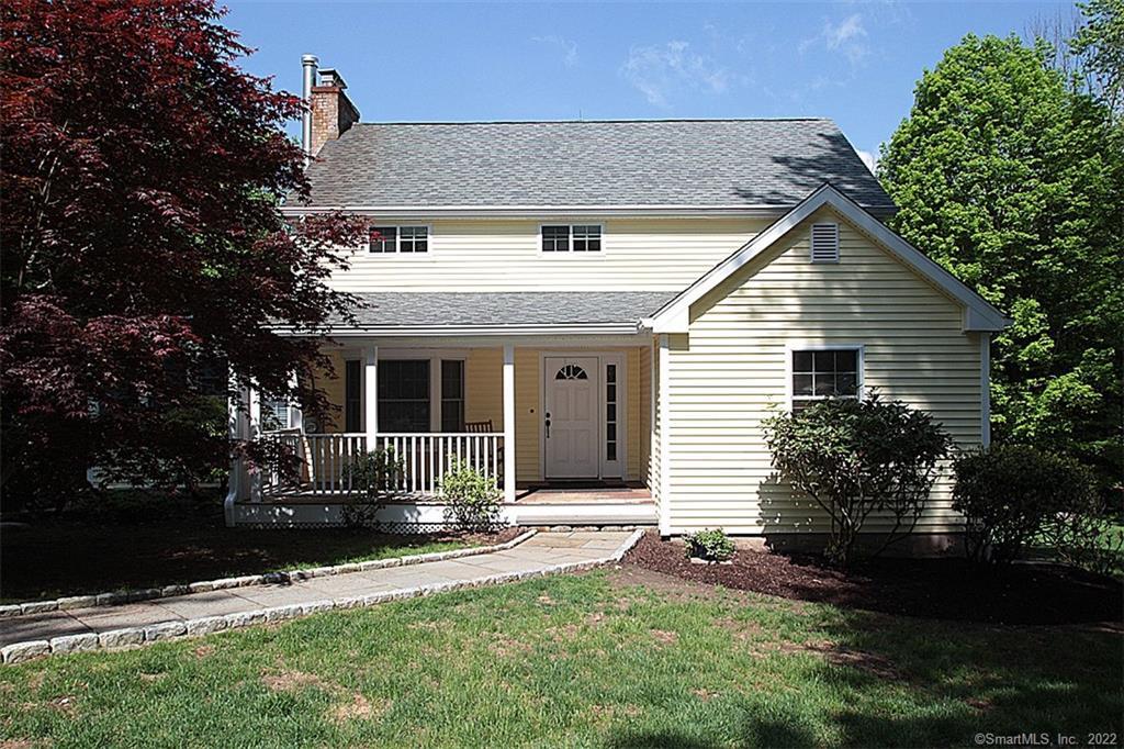 168 Peck Hill Road Woodbridge, CT 06525 - Photo 1 of 1 a front view of a house with garden