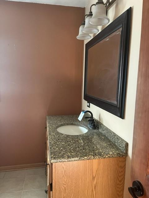 5807 West 122nd Place Crown Point, IN 46307 - Photo 14 of 24 a bathroom with a granite countertop sink and a mirror