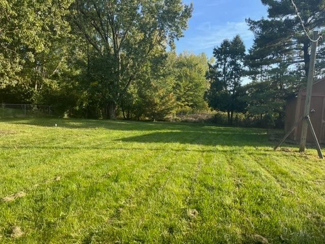 5807 West 122nd Place Crown Point, IN 46307 - Photo 22 of 24 a view of a garden with a lake