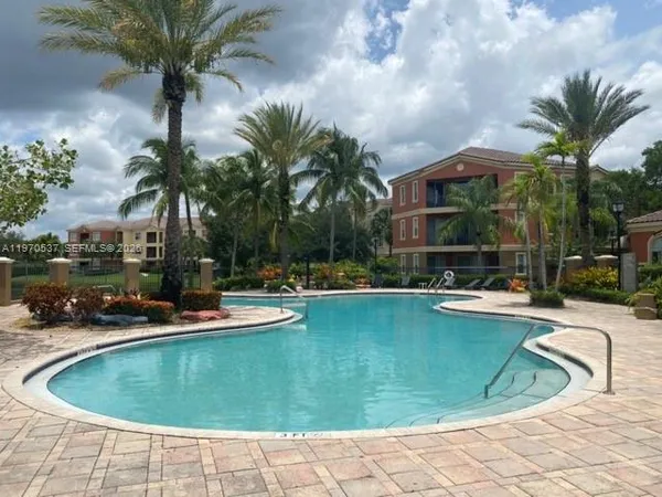 a view of a swimming pool with chairs