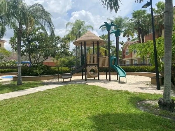 a view of a park with a slide