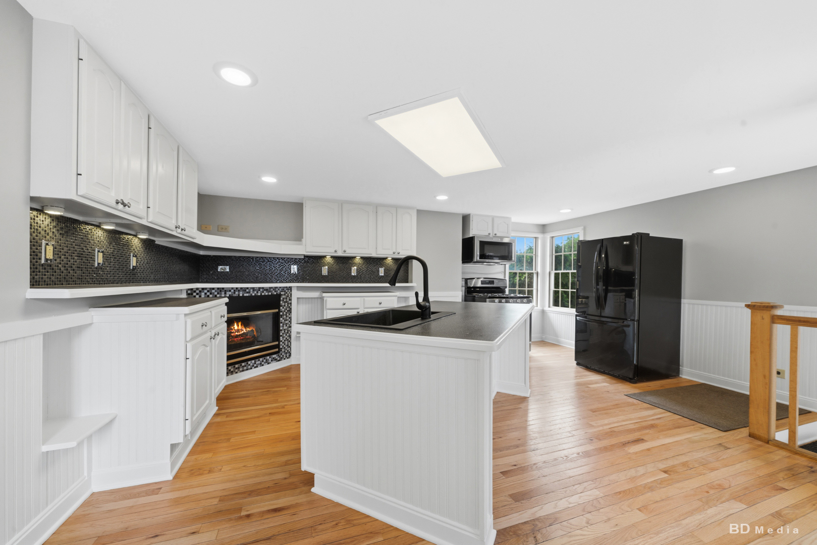 10428 South Springfield Avenue Chicago, IL 60655 - Photo 10 of 43 a kitchen with stainless steel appliances kitchen island granite countertop a refrigerator a stove top oven a sink and dishwasher with wooden floor