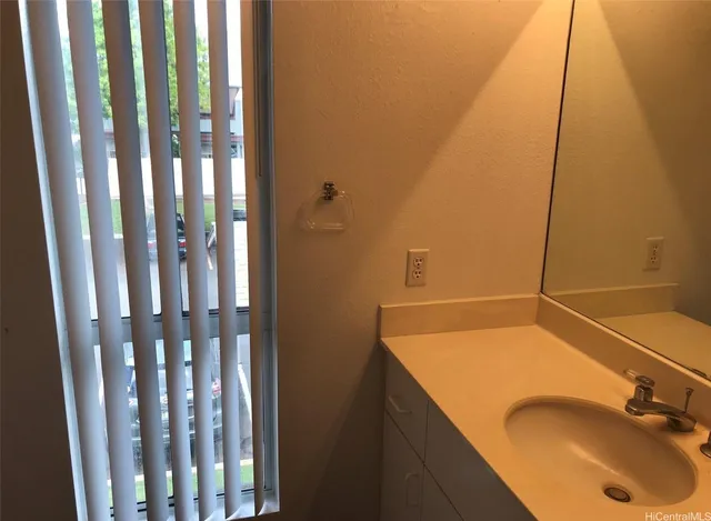 a bathroom with shower sink