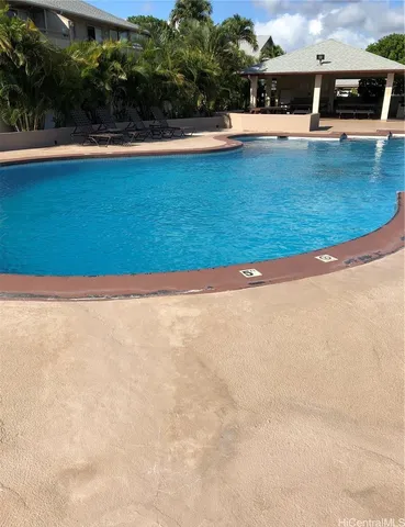 a view of a swimming pool and an outdoor space