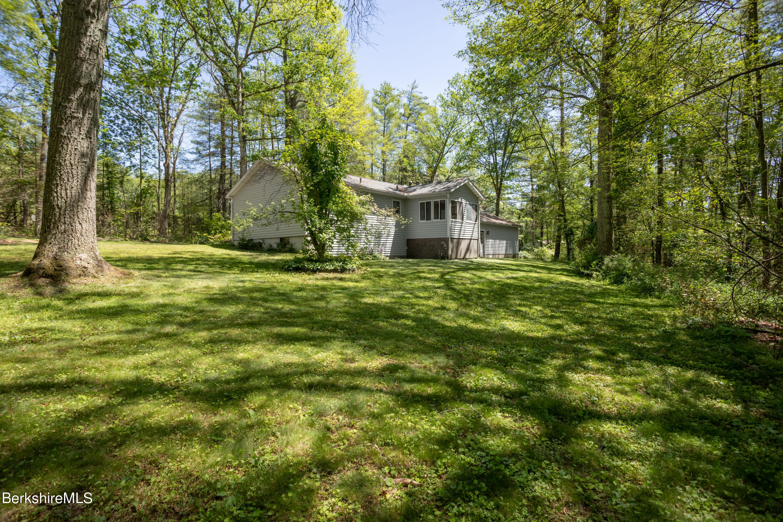 140 Bunce Road North Sheffield, MA 01222 - Photo 4 of 17 a yellow house in middle of a forest
