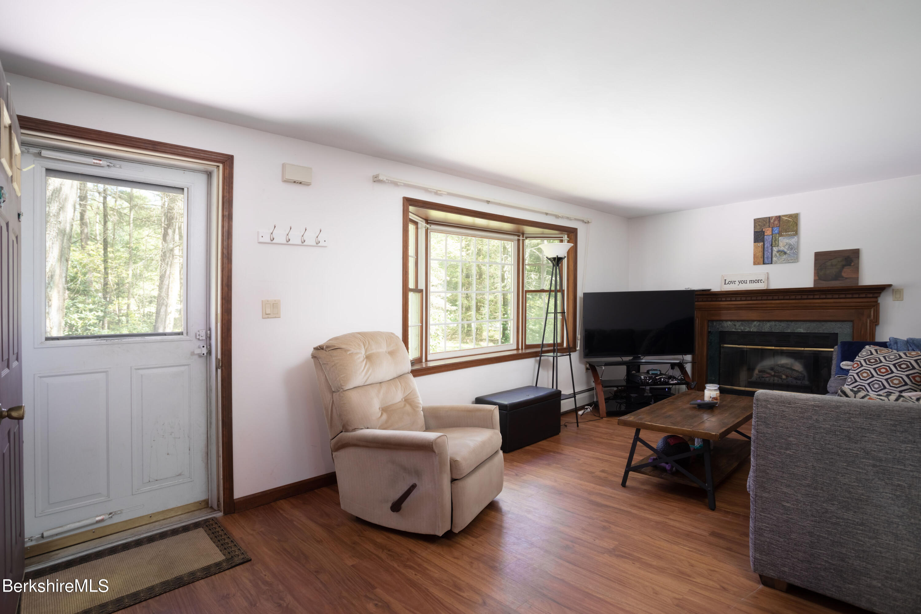 140 Bunce Road North Sheffield, MA 01222 - Photo 8 of 17 a living room with furniture and a fireplace