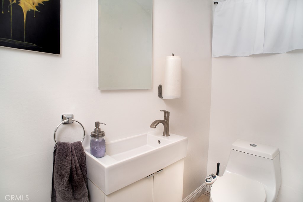 13232 Desmond Street Pacoima, CA 91331 - Photo 11 of 15 a bathroom with a sink and a toilet