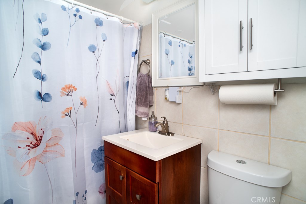 13232 Desmond Street Pacoima, CA 91331 - Photo 10 of 15 a bathroom with a sink toilet and shower