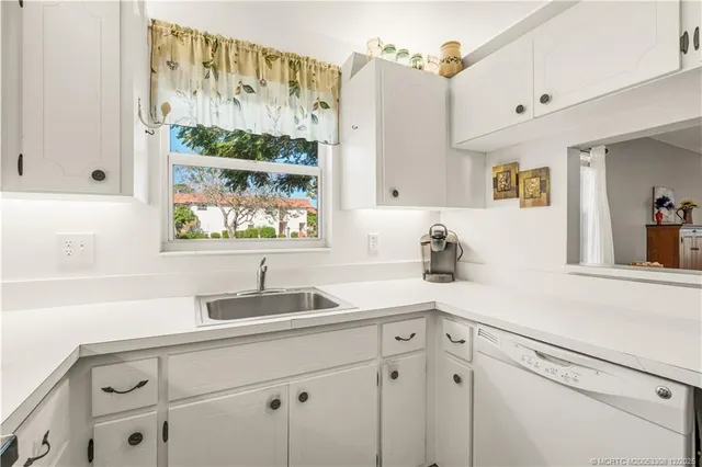 a kitchen with a sink and a window