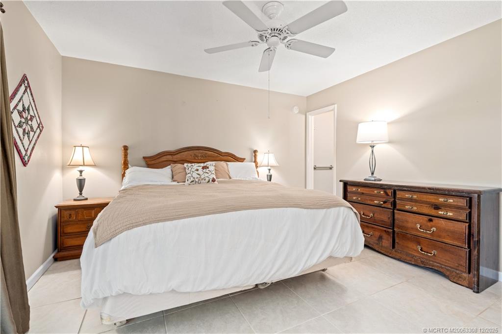 2600 Southeast Ocean Boulevard, Unit F7 Stuart, FL 34996 - Photo 20 of 54 a bedroom with a bed and a dresser
