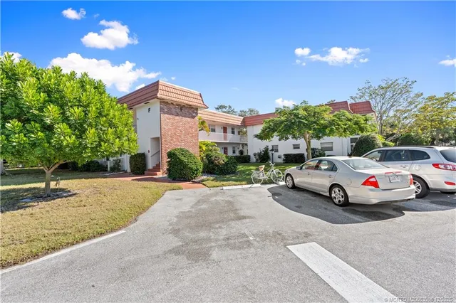 a view of street with parked cars