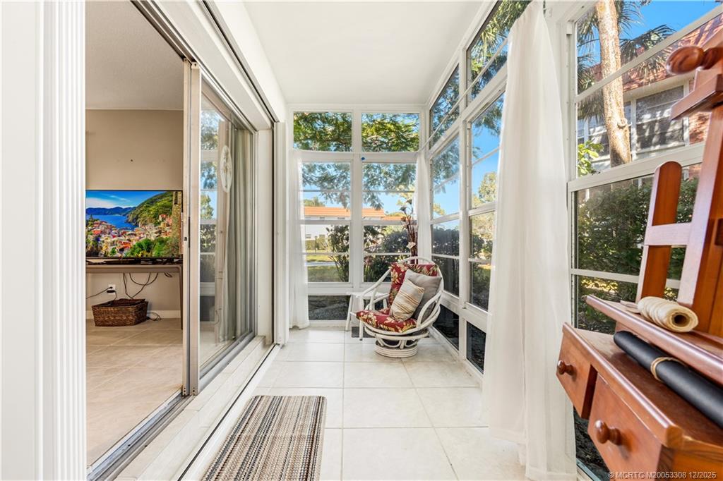 2600 Southeast Ocean Boulevard, Unit F7 Stuart, FL 34996 - Photo 32 of 54 a view of a balcony with chair and front door