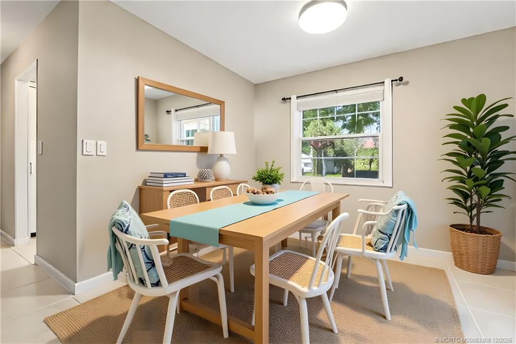 2600 Southeast Ocean Boulevard, Unit F7 Stuart, FL 34996 - Photo 6 of 54 a dining room with furniture and window