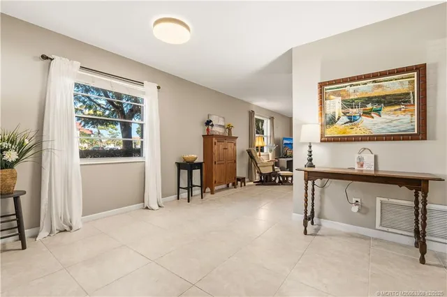 a view of a livingroom with furniture and window