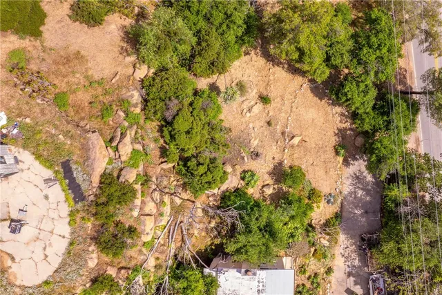 a backyard of a house with lots of trees