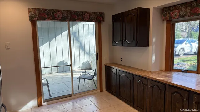 a kitchen with a refrigerator and a sink