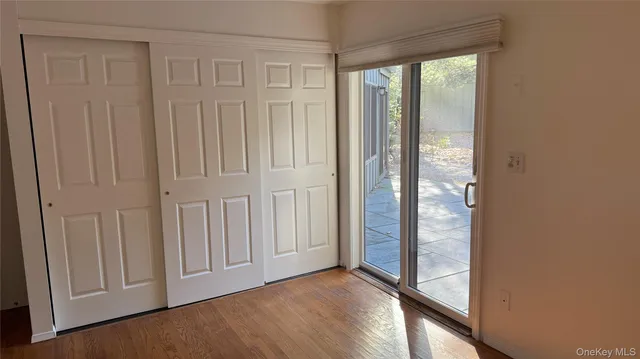a view of front door with wooden floor