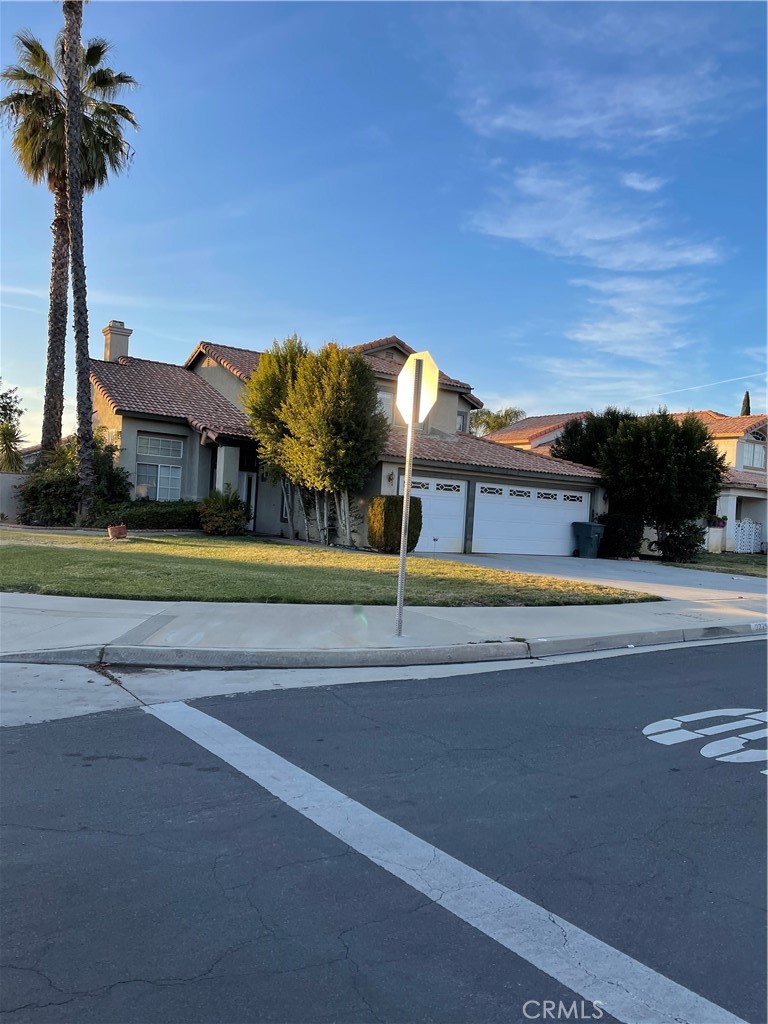 9279 Middlefield Drive Riverside, CA 92508 - Photo 2 of 26 a view of swimming pool with a yard and palm trees