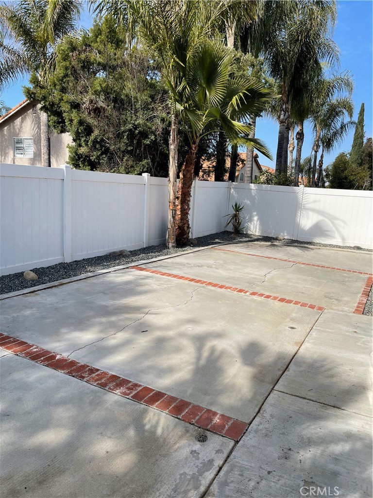 9279 Middlefield Drive Riverside, CA 92508 - Photo 22 of 26 a view of white house next to a road and yard