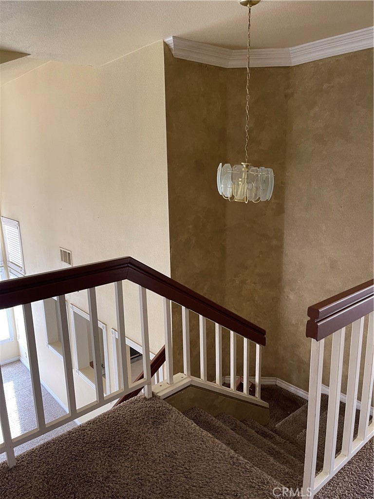 9279 Middlefield Drive Riverside, CA 92508 - Photo 7 of 26 a view of staircase with railing and white walls