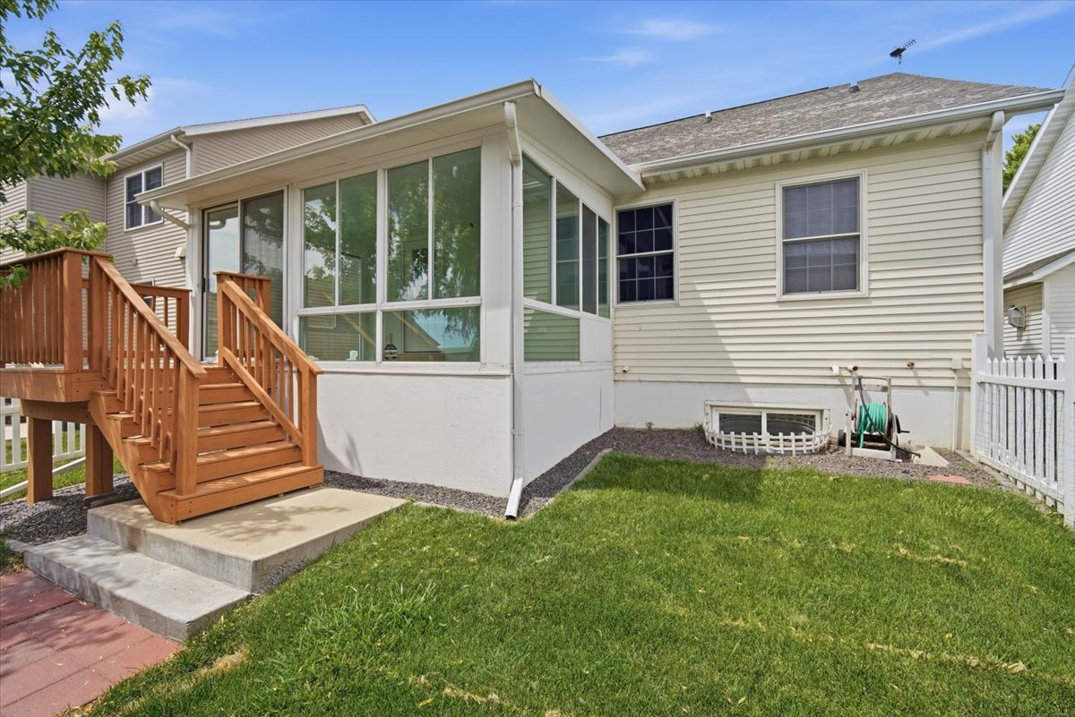 915 Teegan Street Normal, IL 61761 - Photo 29 of 33 a view of a house with a yard and a porch