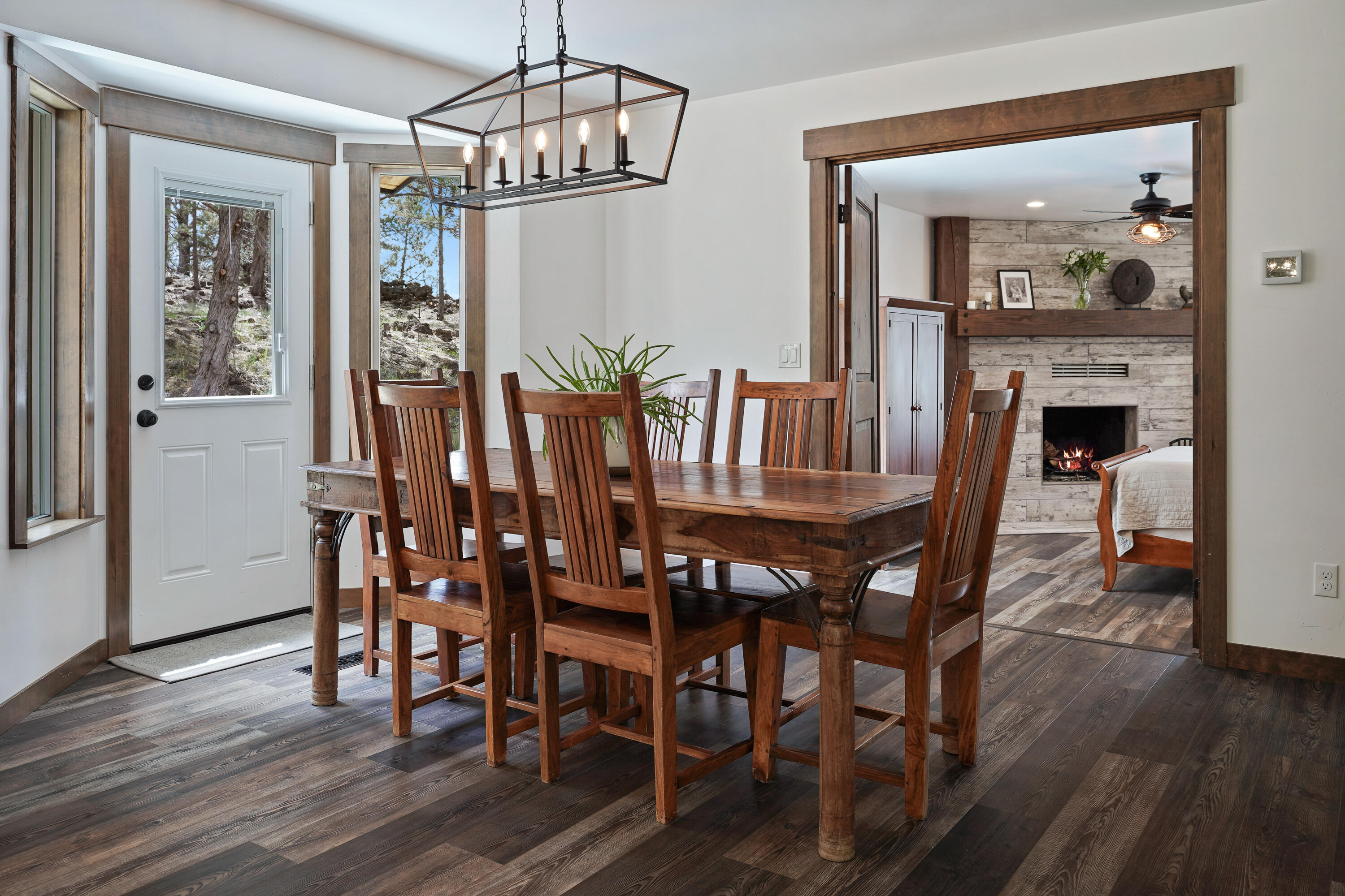 64732 Hunnell Road Bend, OR 97703 - Photo 12 of 51 a view of a dining room with furniture wooden floor and chandelier