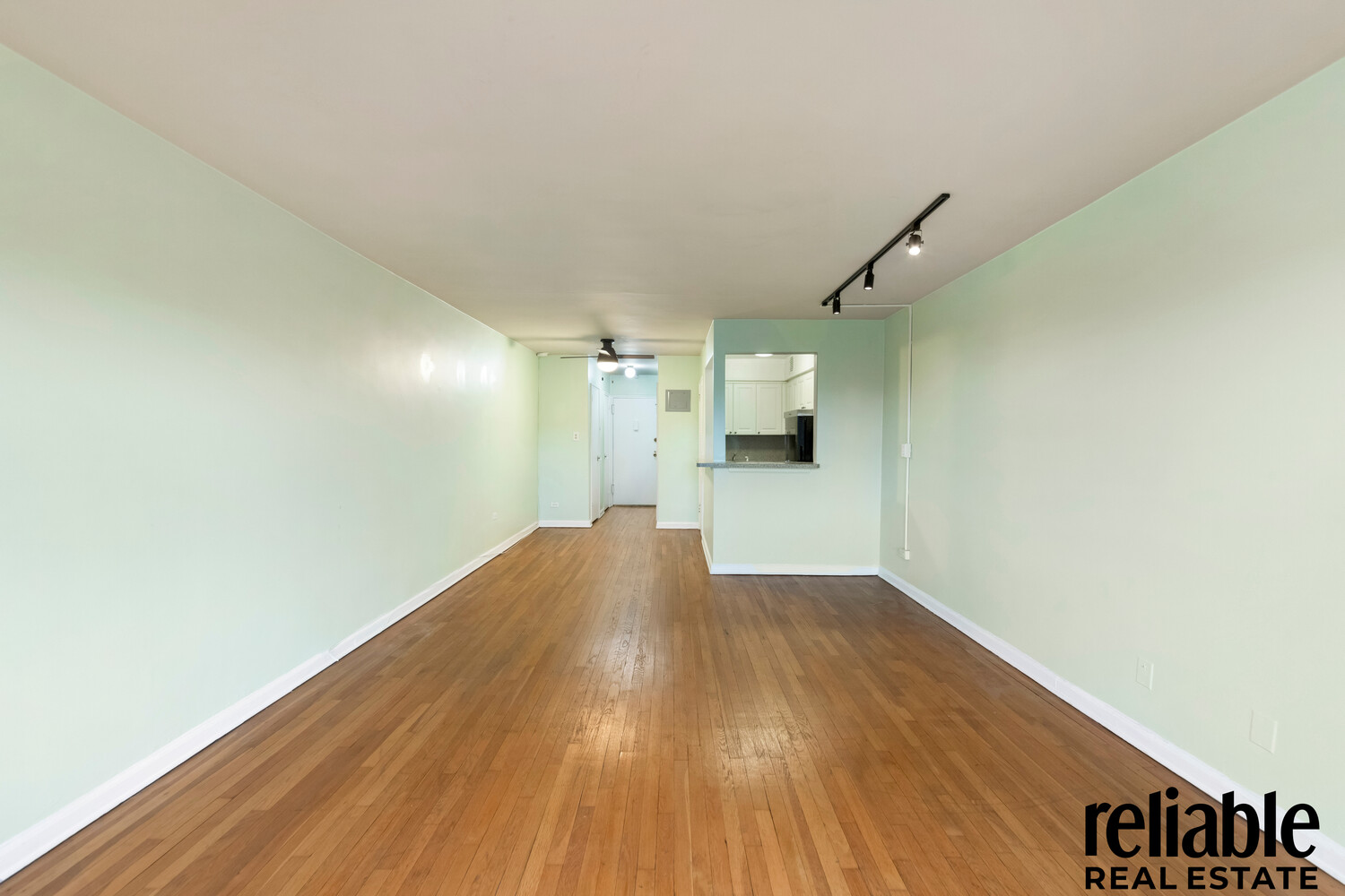 5235 Post Road, Unit 3H Bronx, NY 10471 - Photo 3 of 10 a view of empty room with wooden floor