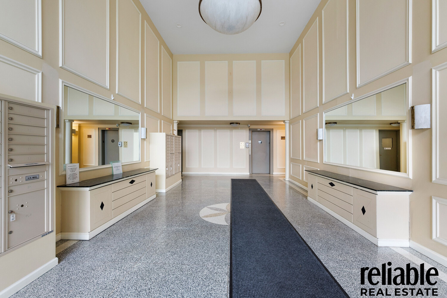 5235 Post Road, Unit 3H Bronx, NY 10471 - Photo 8 of 10 wooden floor with white cabinets and window
