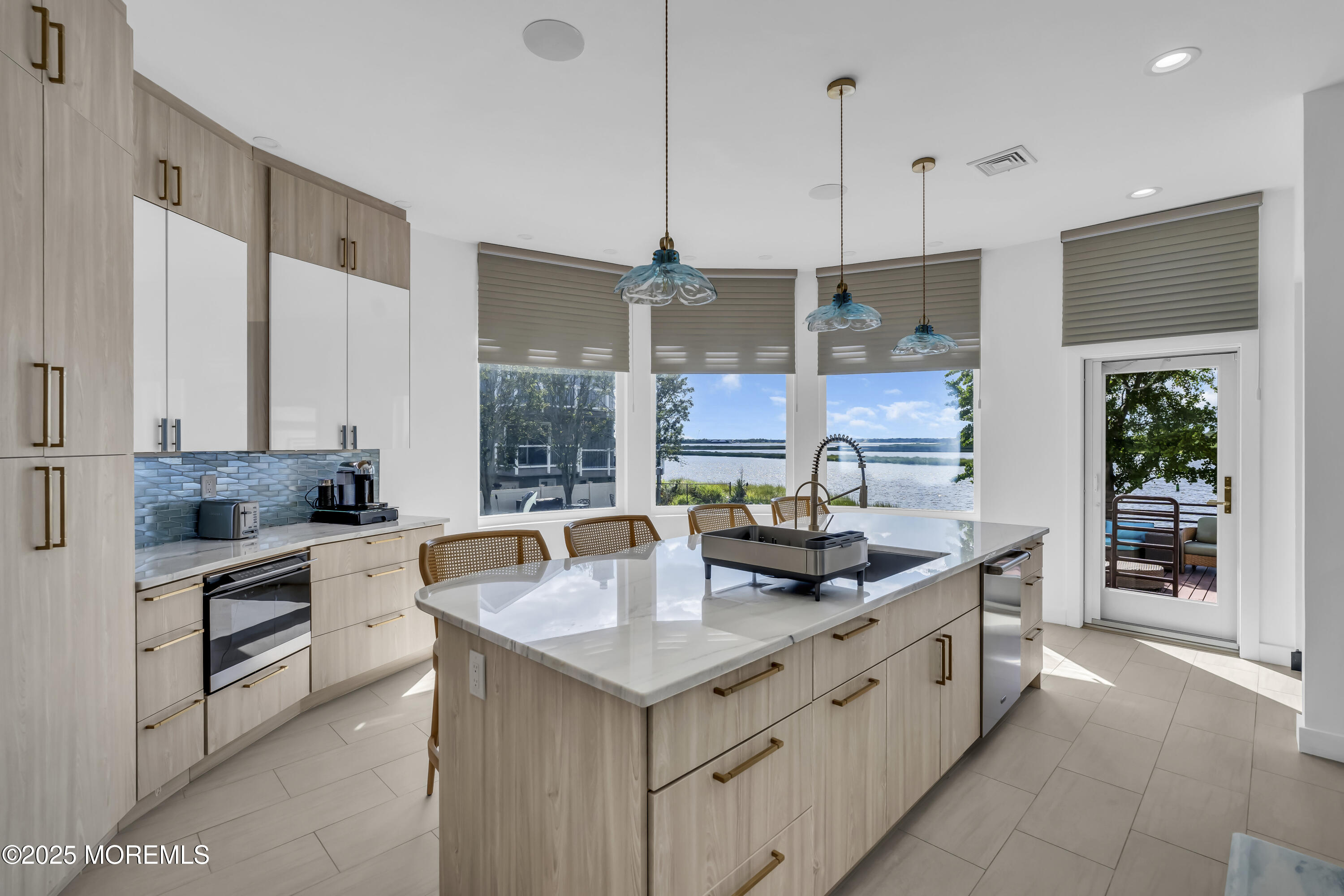 1 Island View Way Sea Bright, NJ 07760 - Photo 19 of 79 a kitchen with stainless steel appliances granite countertop a sink stove and cabinets