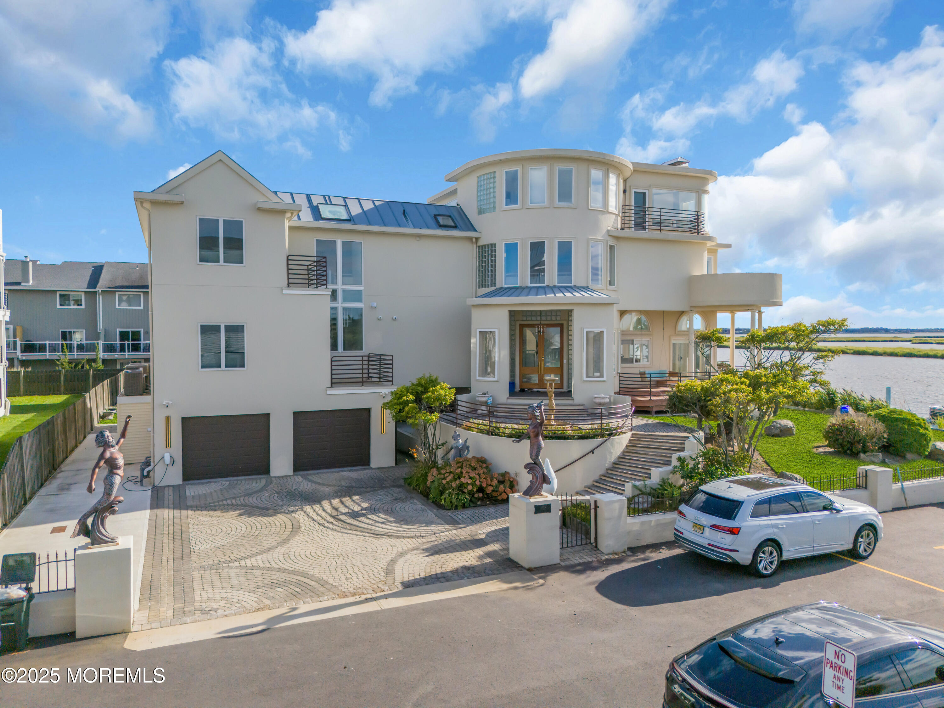 1 Island View Way Sea Bright, NJ 07760 - Photo 2 of 79 a front view of a house with garden