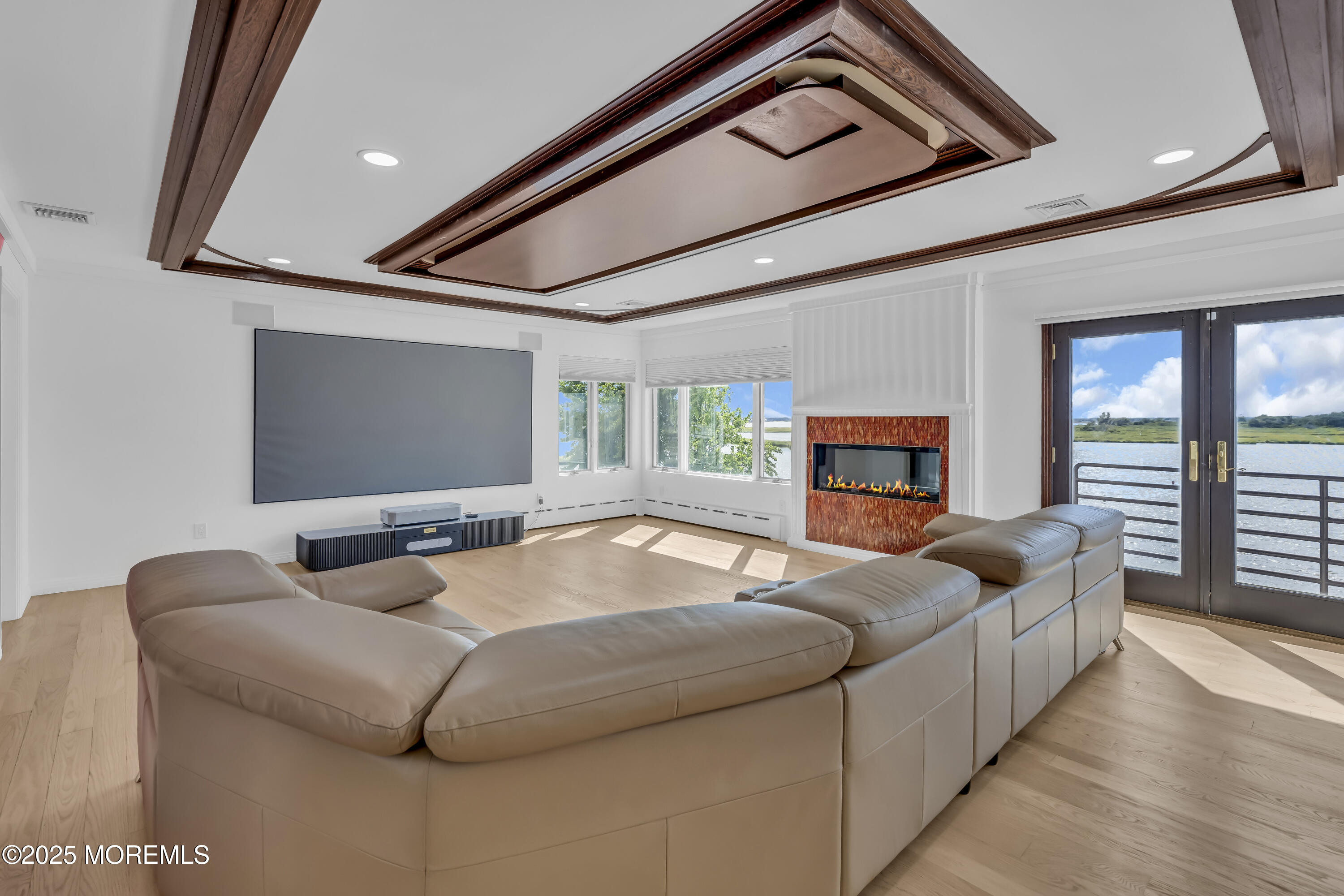 1 Island View Way Sea Bright, NJ 07760 - Photo 40 of 79 a living room with furniture and a flat screen tv