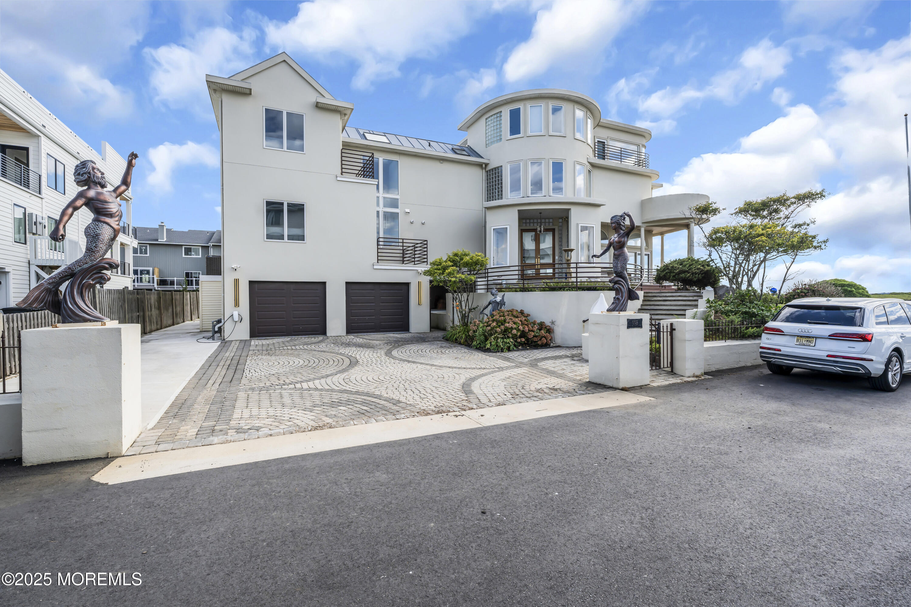 1 Island View Way Sea Bright, NJ 07760 - Photo 4 of 79 a view of a white house with a large space and a car park in front of it