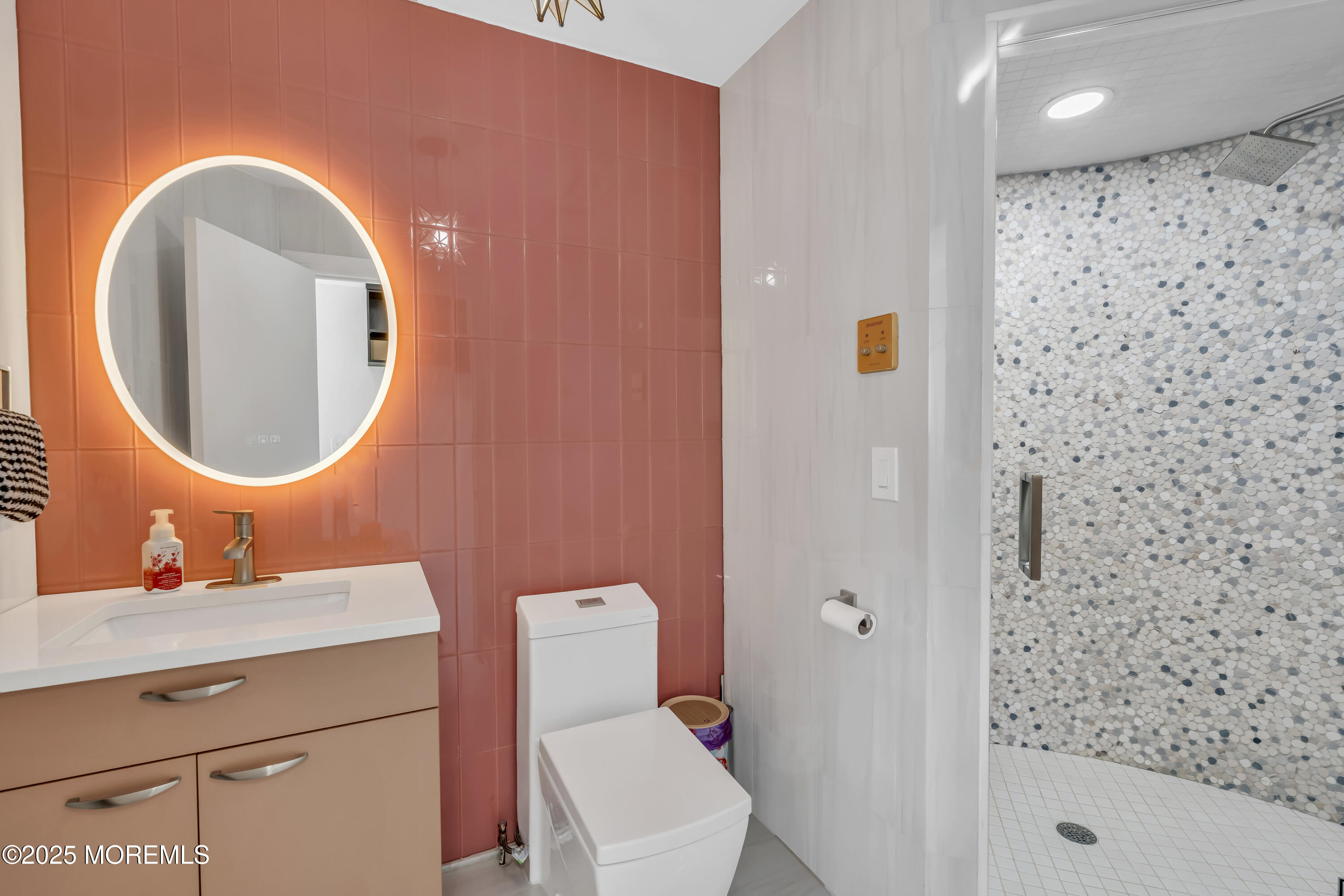 1 Island View Way Sea Bright, NJ 07760 - Photo 44 of 79 a bathroom with a sink mirror vanity and toilet