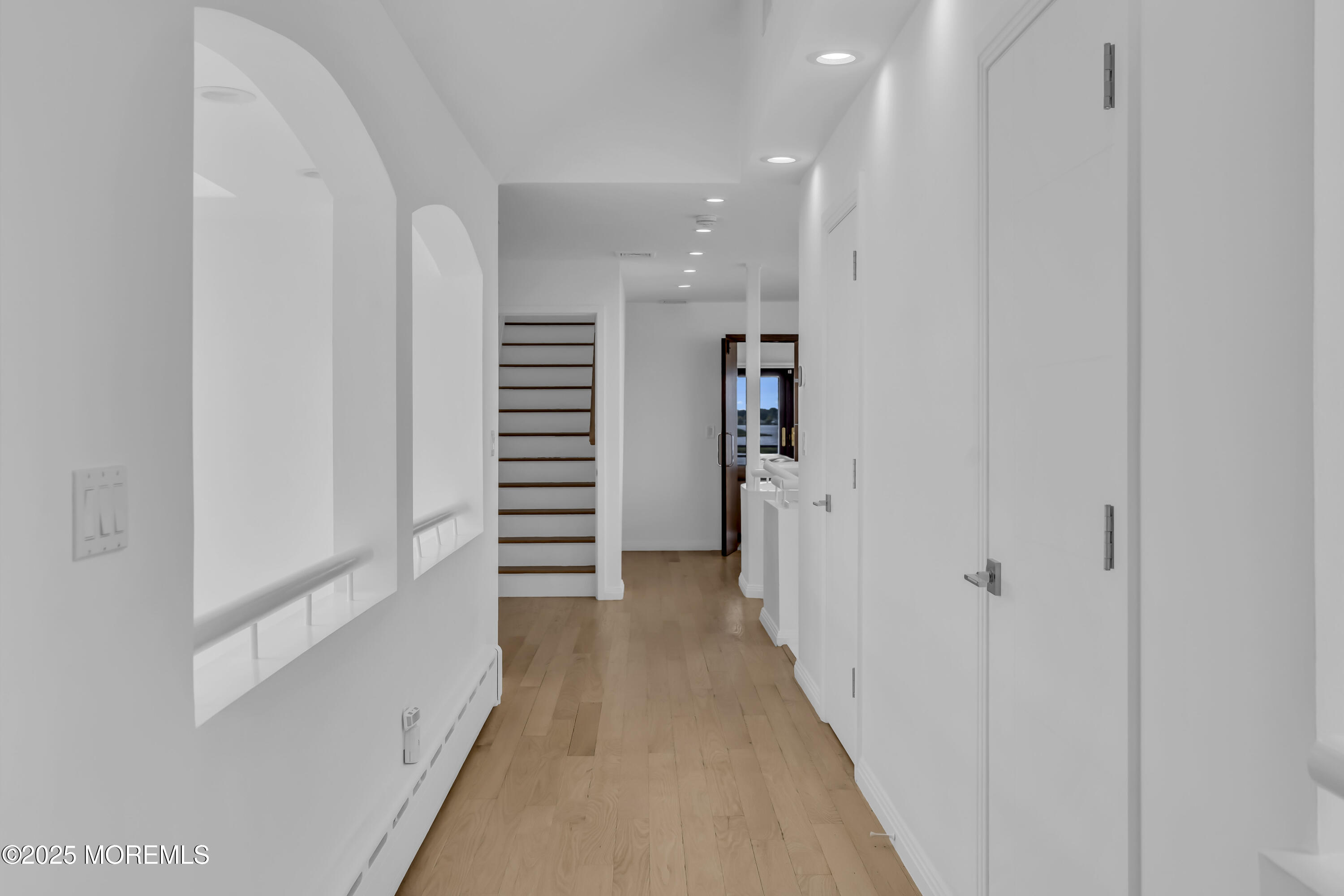 1 Island View Way Sea Bright, NJ 07760 - Photo 53 of 79 a view of a hallway with wooden floor and closet