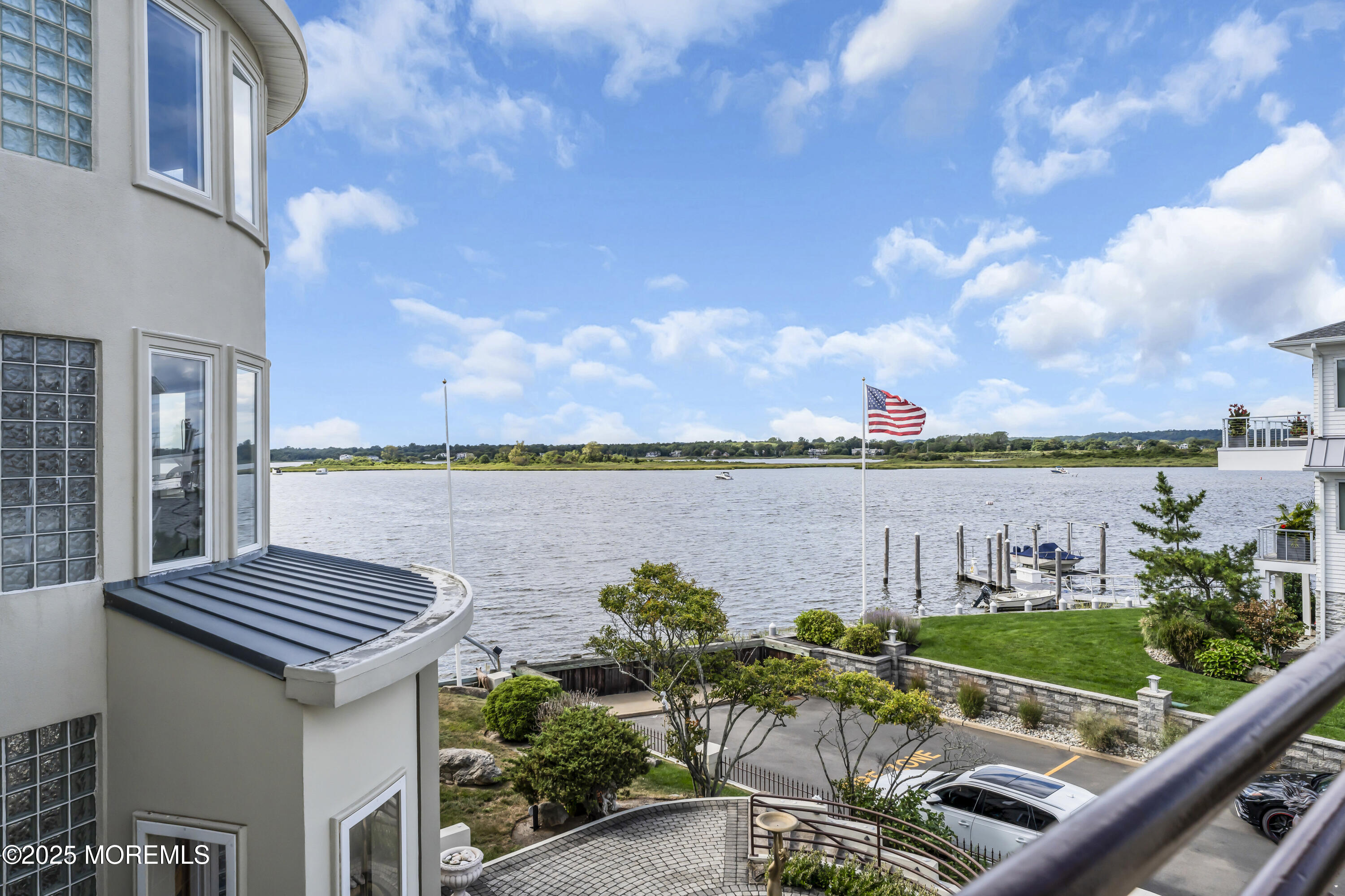 1 Island View Way Sea Bright, NJ 07760 - Photo 57 of 79 a view of a balcony with two chairs and a yard
