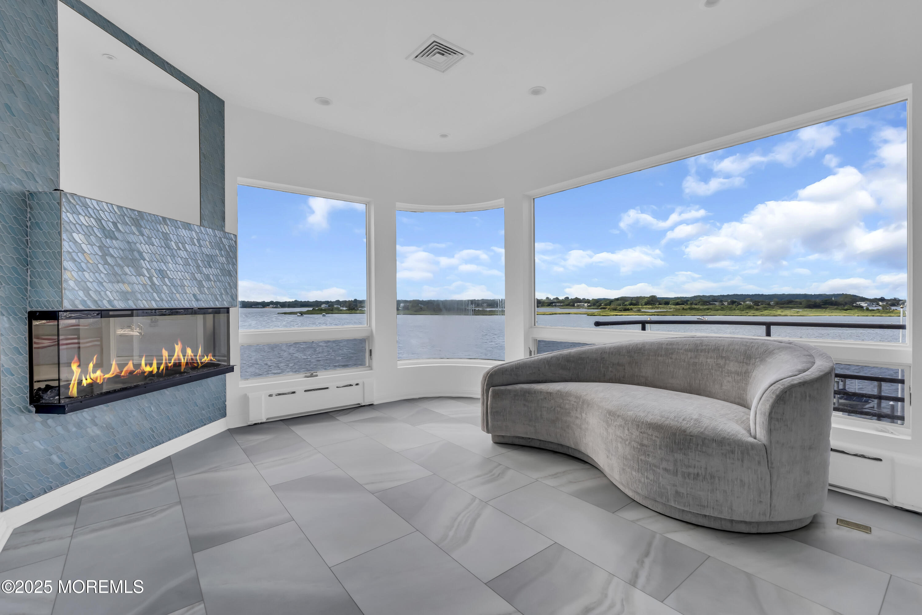1 Island View Way Sea Bright, NJ 07760 - Photo 62 of 79 a living room with furniture and a floor to ceiling window