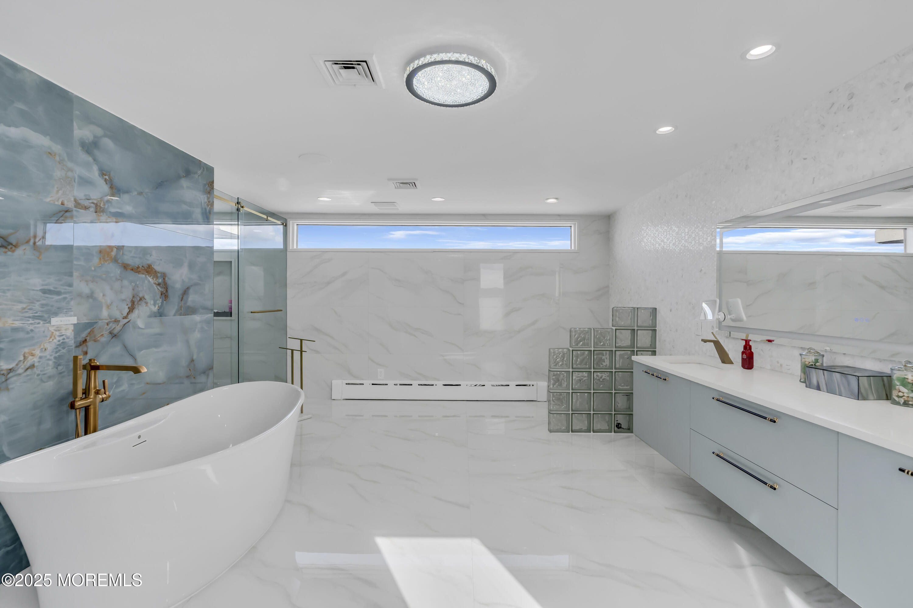 1 Island View Way Sea Bright, NJ 07760 - Photo 64 of 79 a bathroom with a bathtub and a sink