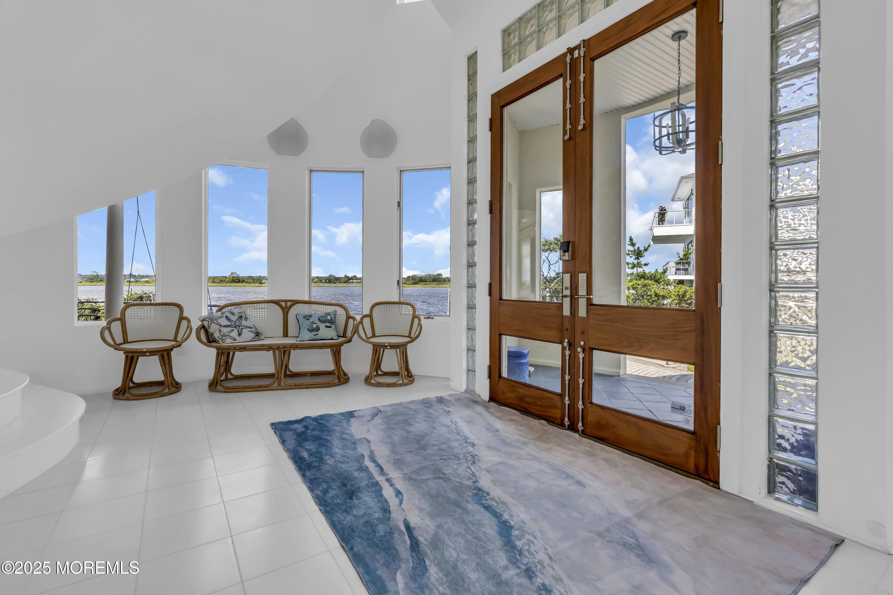 1 Island View Way Sea Bright, NJ 07760 - Photo 7 of 79 a living room with furniture and a floor to ceiling window